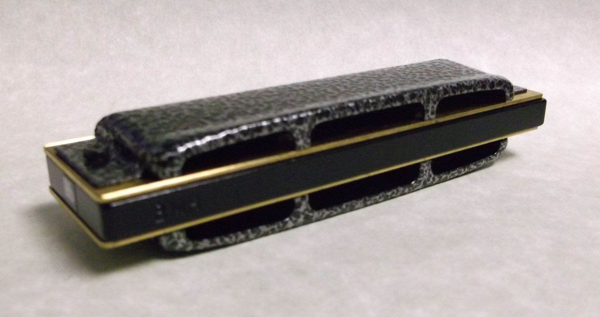Hohner Cross Harp, Key of Bb, Black Aluminum Comb, Silver Vein Covers photo 2316g_zps529dc060.jpg