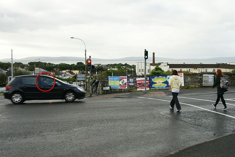 Motorist-on-mobile-phone-drives-through-Green-Man_zps377c34df.jpg